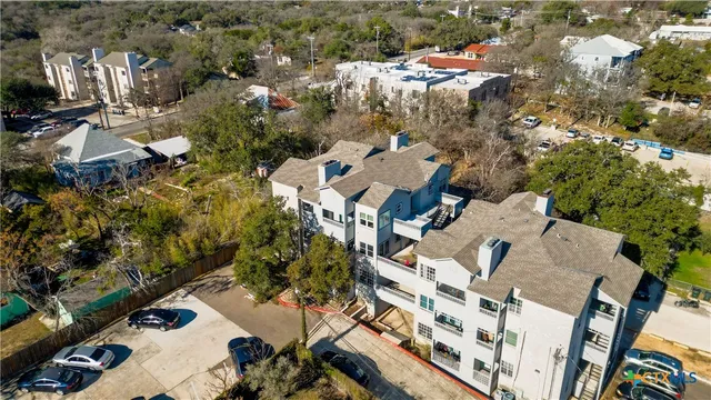 a view of roof deck with a barbeque and wooden stairs