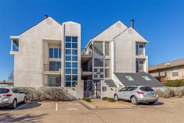 a car parked in front of a building