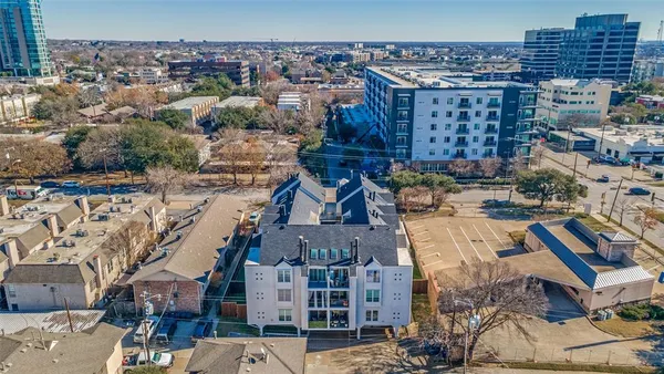 an aerial view of a building with parking space
