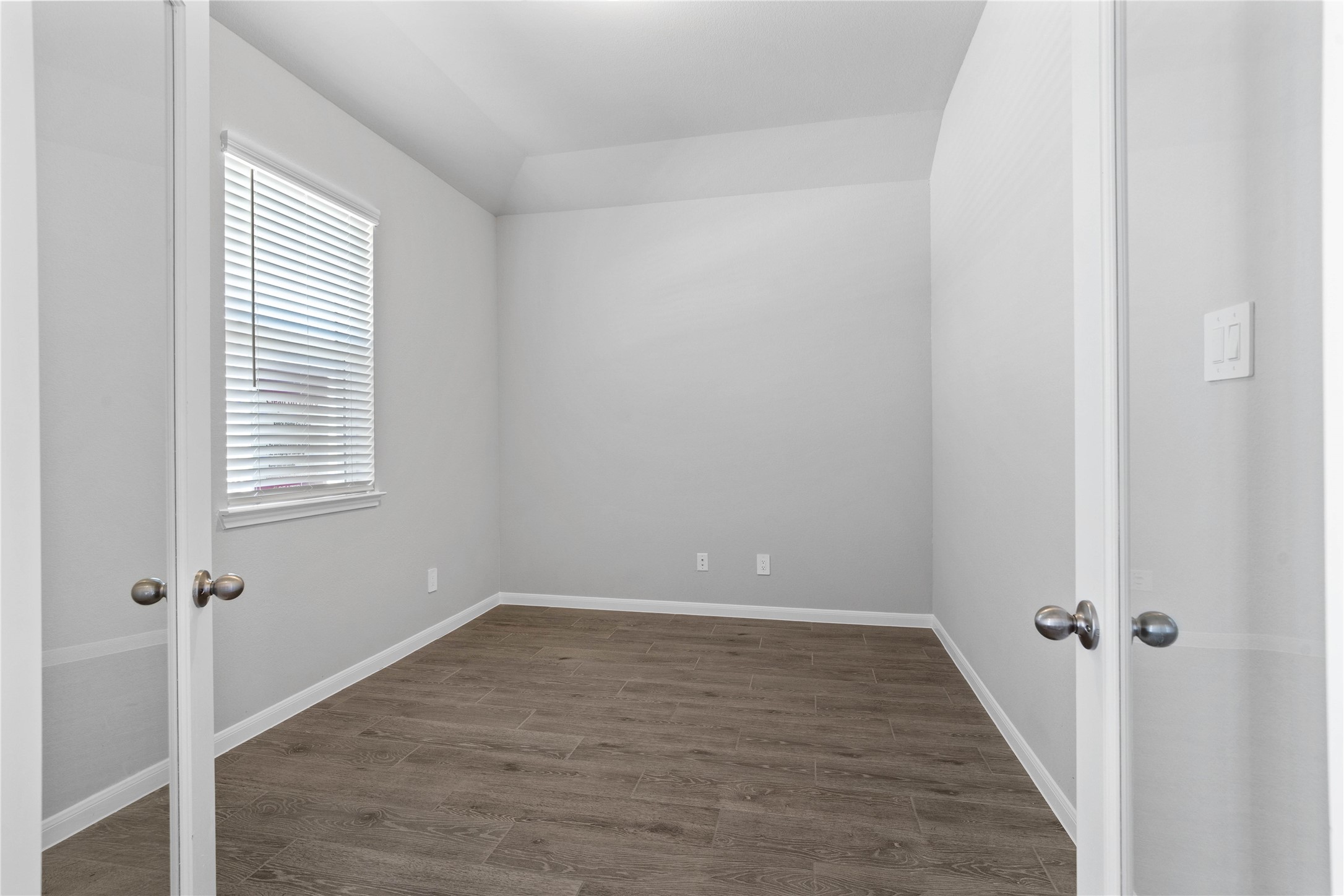19657 Montgomery Rdg Way Montgomery, TX 77316 - Photo 8 of 49 This handsome home office features wood-look tile flooring, large window (fitted with blinds), high sloped ceilings, French doors, and custom paint!