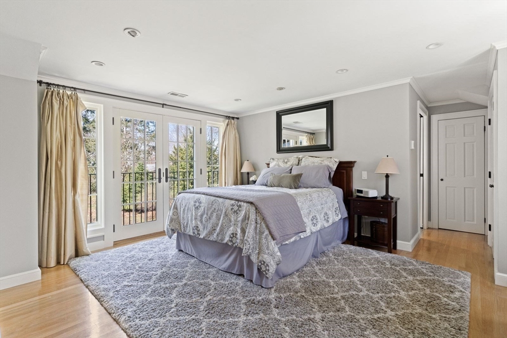 14 Winthrop Road Wayland, MA 01778 - Photo 11 of 25 a bedroom with a large bed and a window