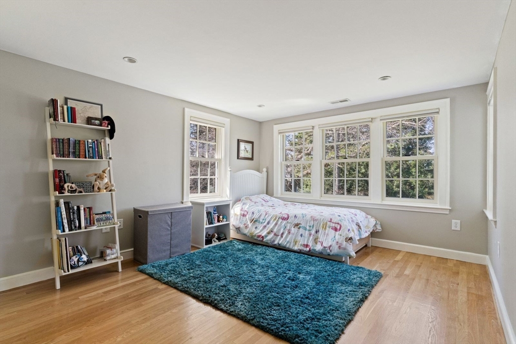 14 Winthrop Road Wayland, MA 01778 - Photo 15 of 25 a bed sitting in a bedroom next to a window