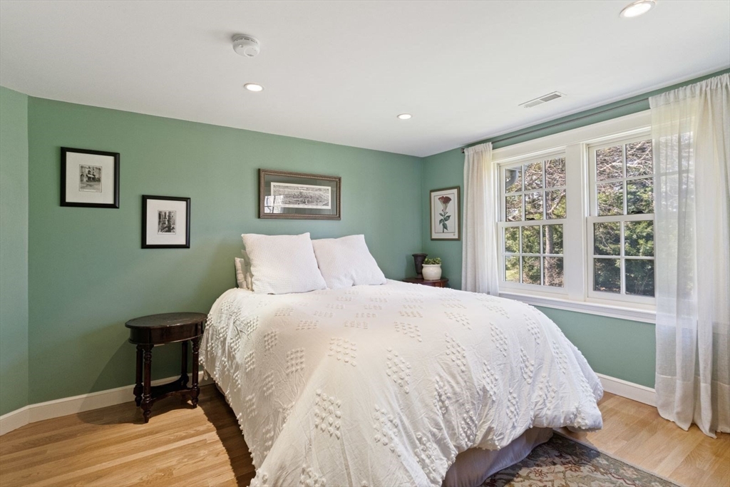 14 Winthrop Road Wayland, MA 01778 - Photo 16 of 25 a spacious bedroom with a bed and a window