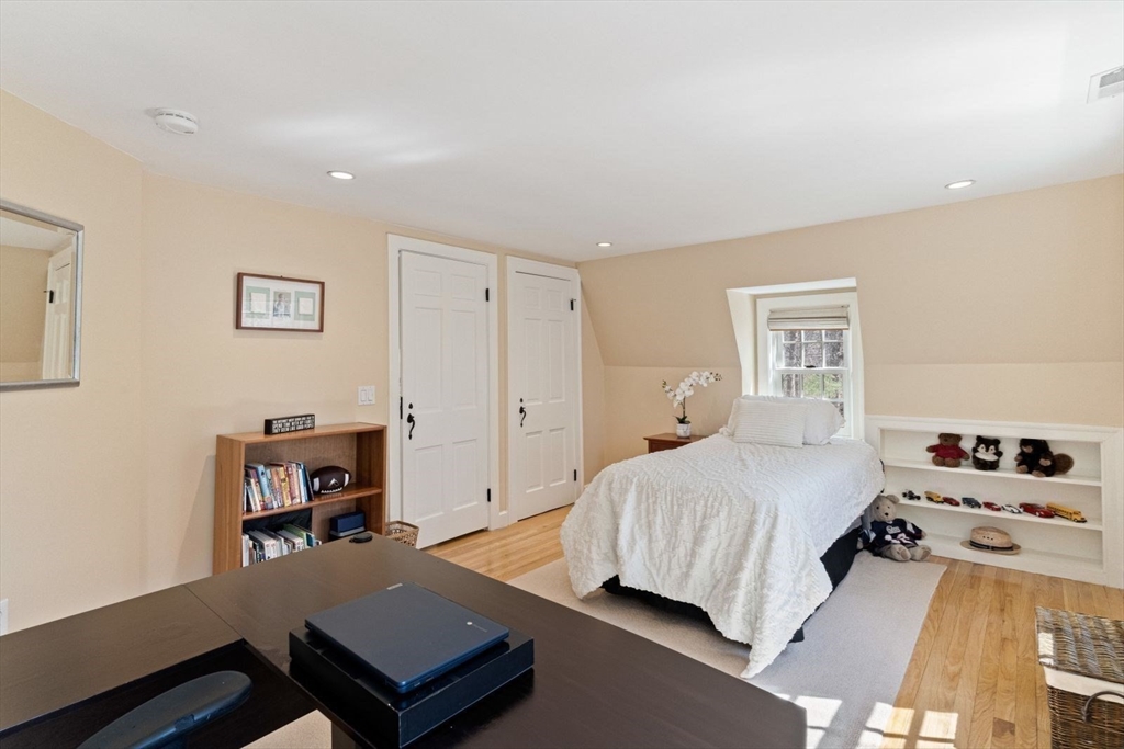 14 Winthrop Road Wayland, MA 01778 - Photo 19 of 25 a bedroom with a bed and a window