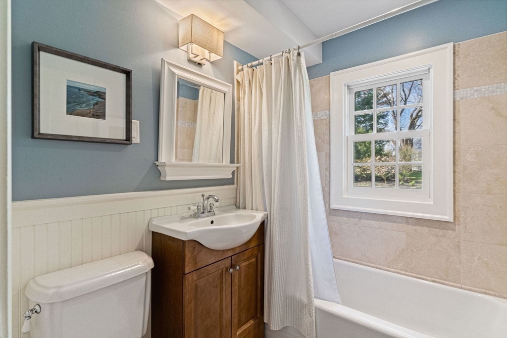 14 Winthrop Road Wayland, MA 01778 - Photo 20 of 25 a bathroom with a sink a toilet and shower