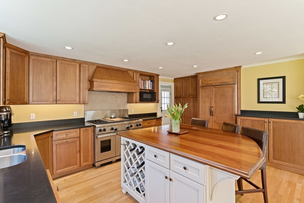 14 Winthrop Road Wayland, MA 01778 - Photo 2 of 25 a kitchen with stainless steel appliances granite countertop a stove a sink and a refrigerator