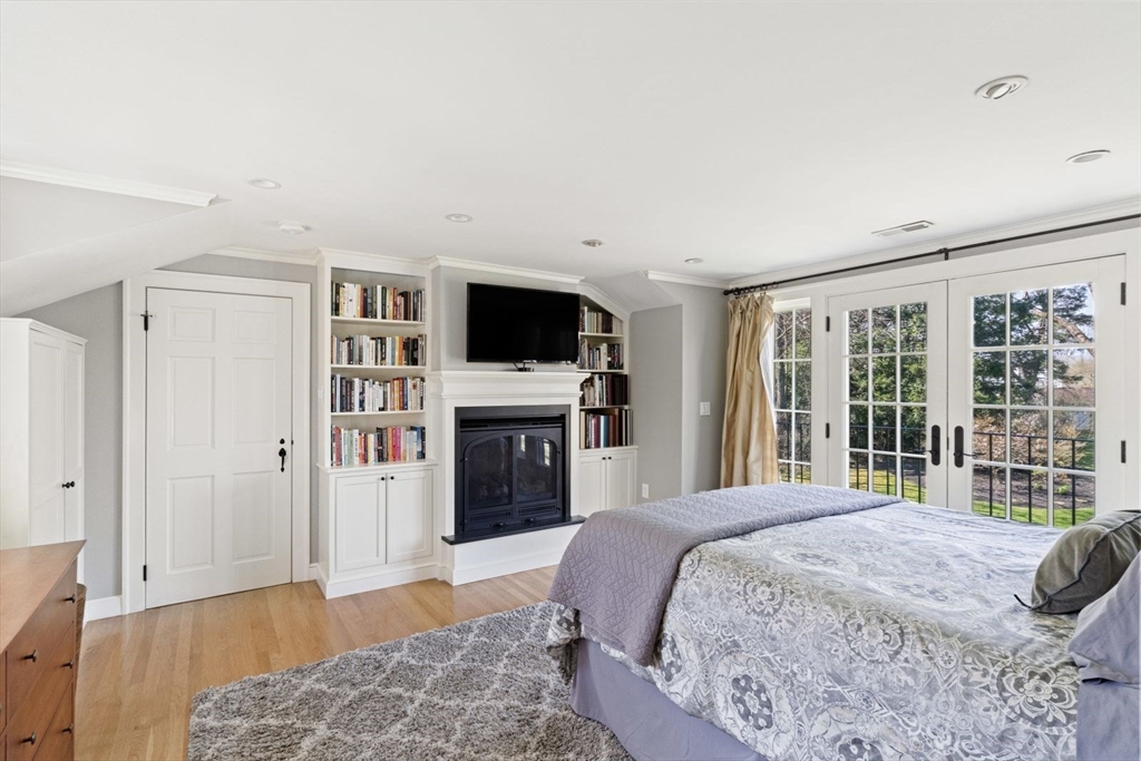 14 Winthrop Road Wayland, MA 01778 - Photo 10 of 25 a spacious bedroom with a large bed and a flat screen tv