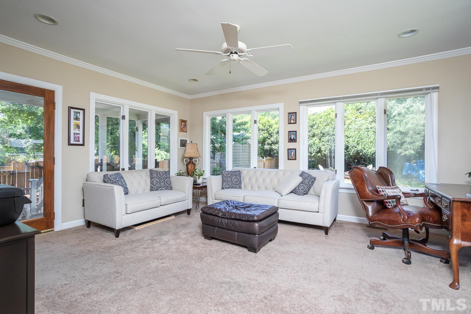 3001 Old Orchard Road Raleigh, NC 27607 - Photo 6 of 12 a living room with furniture and a large window