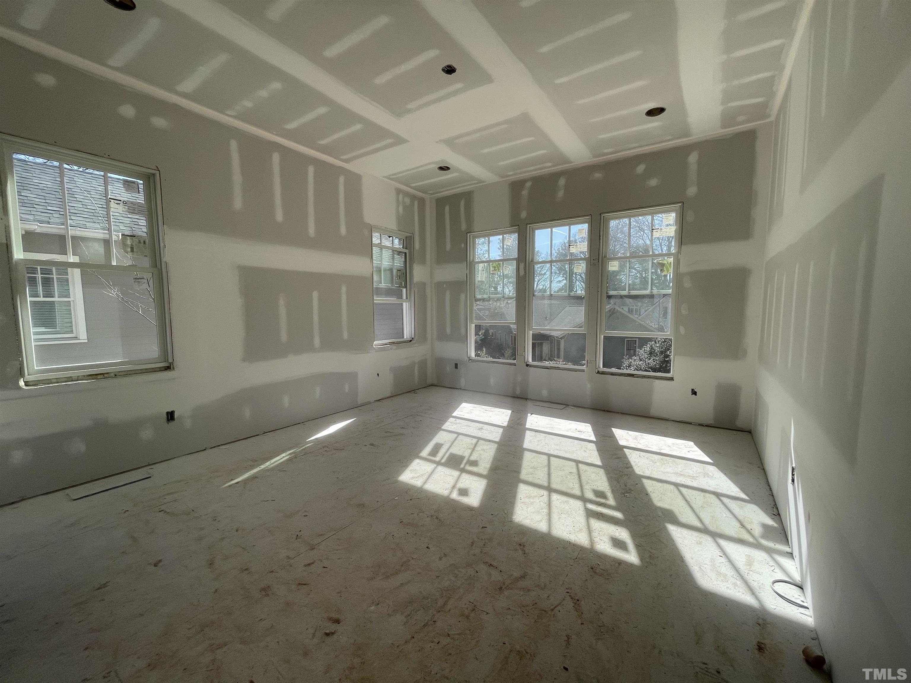 505 Harvey Street Raleigh, NC 27608 - Photo 11 of 31 an empty room with windows