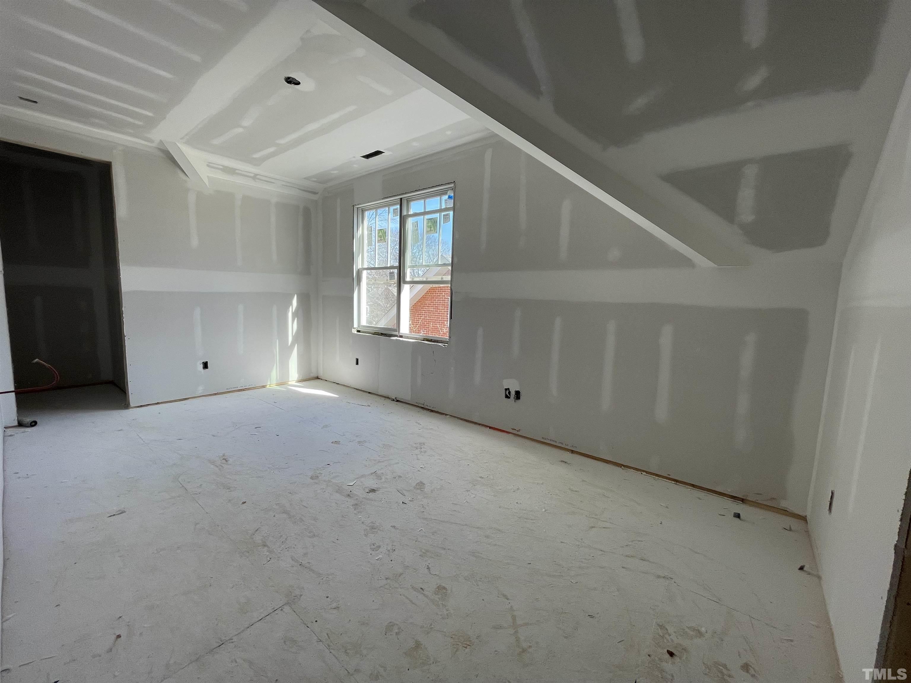 505 Harvey Street Raleigh, NC 27608 - Photo 14 of 31 a view of an empty room with windows