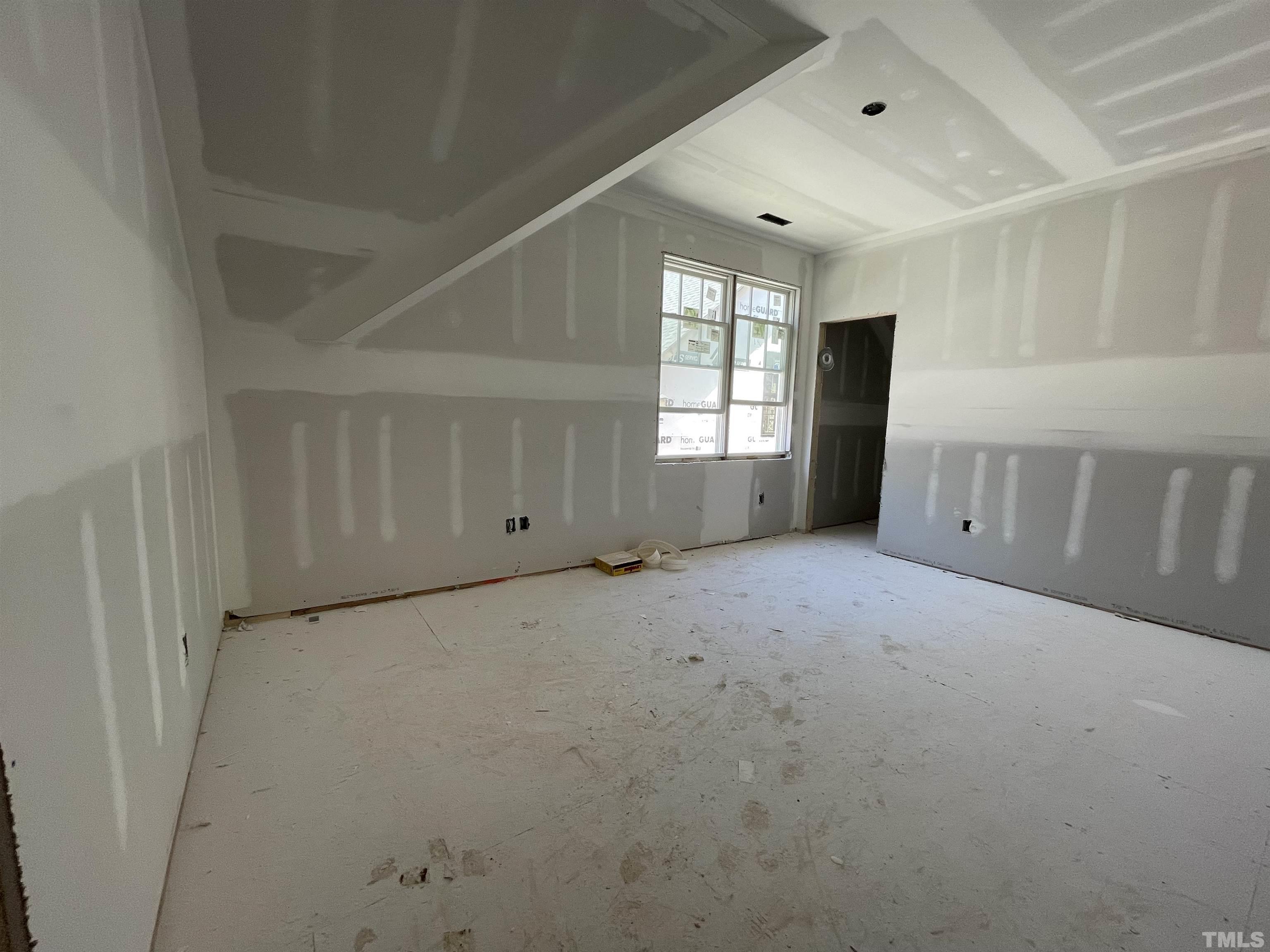 505 Harvey Street Raleigh, NC 27608 - Photo 16 of 31 a view of an empty room with a window
