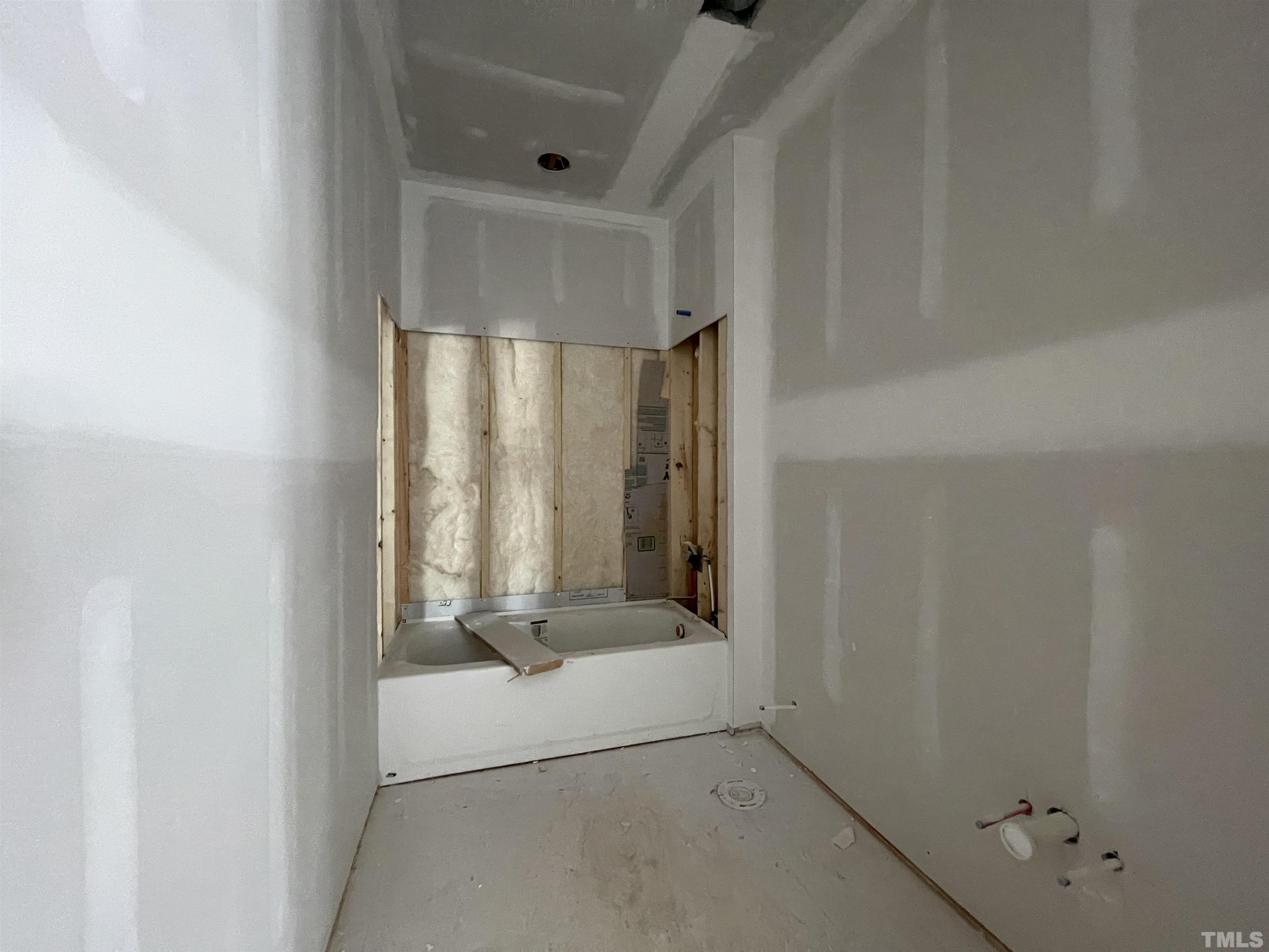 505 Harvey Street Raleigh, NC 27608 - Photo 17 of 31 a bathroom with a glass shower door