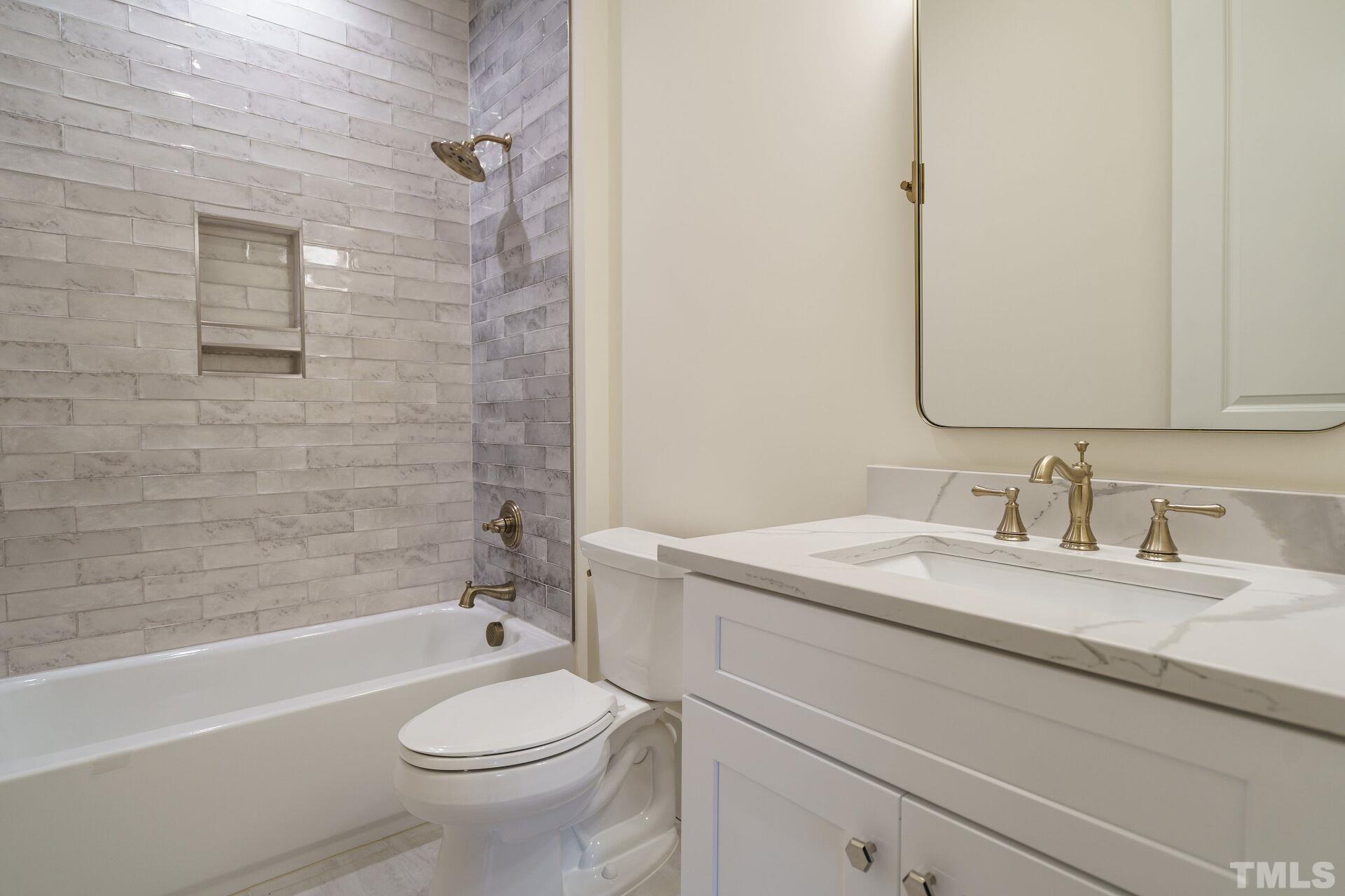 505 Harvey Street Raleigh, NC 27608 - Photo 23 of 31 a bathroom with a granite countertop sink toilet and shower