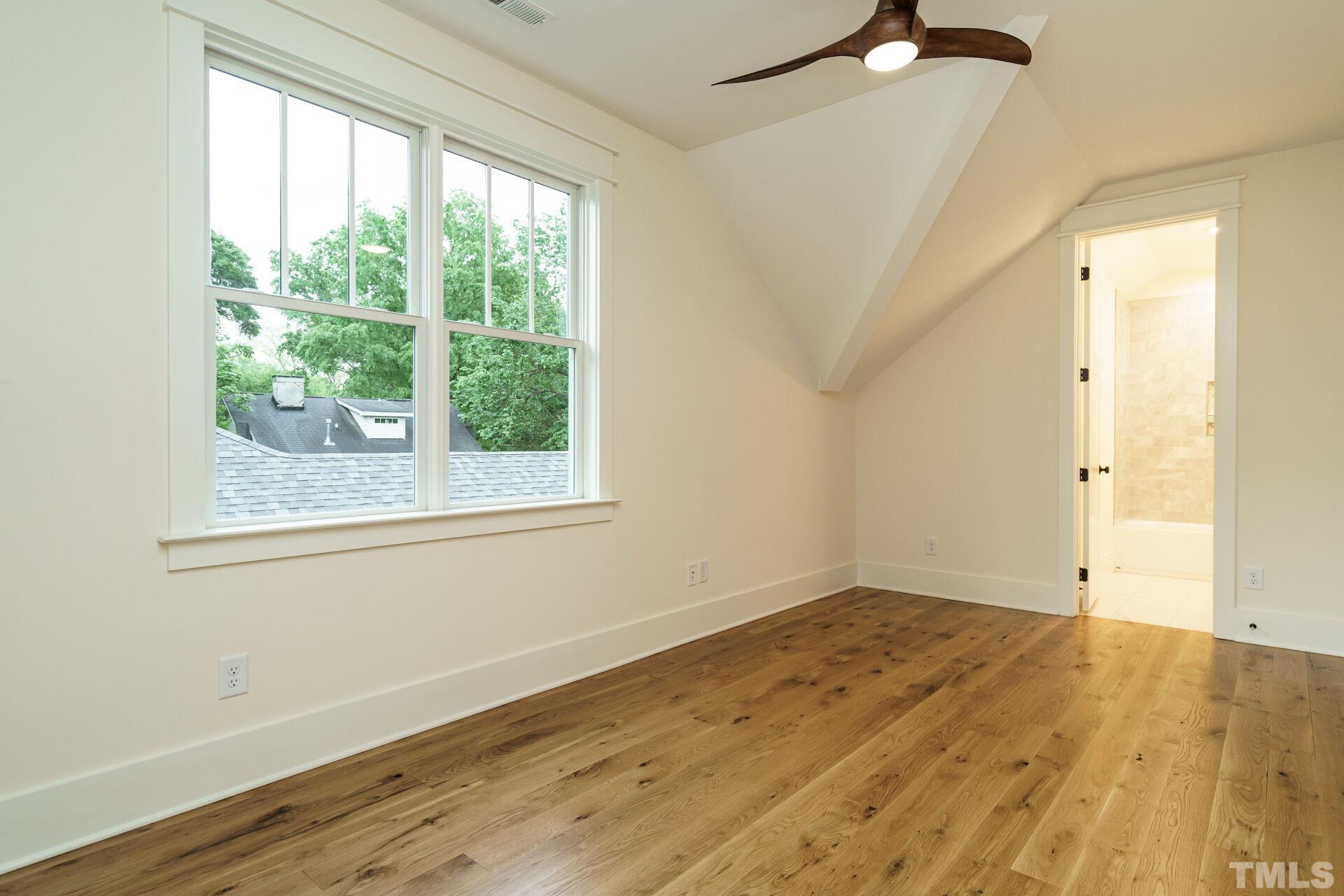 505 Harvey Street Raleigh, NC 27608 - Photo 25 of 31 a view of empty room with wooden floor and fan