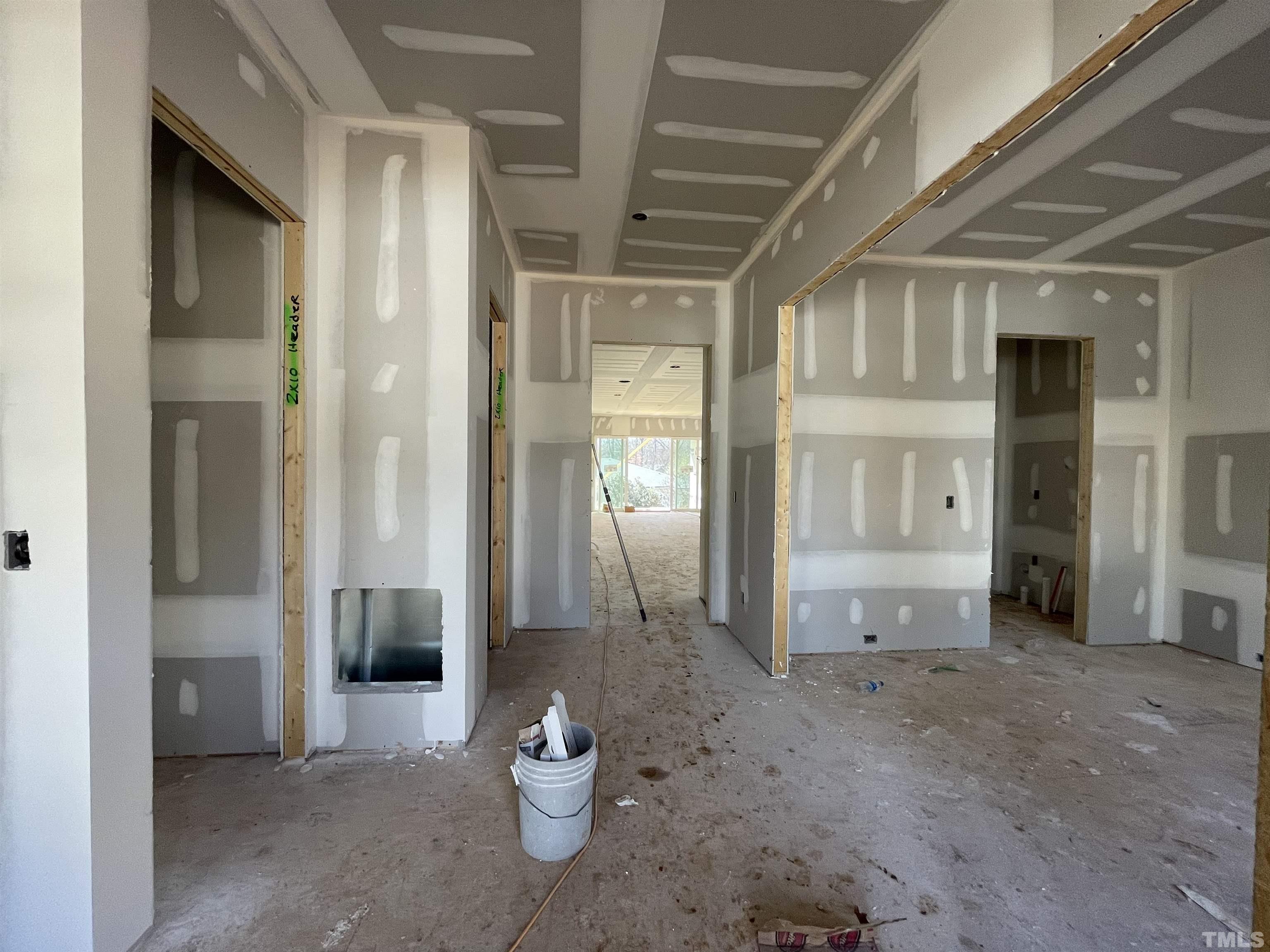 505 Harvey Street Raleigh, NC 27608 - Photo 6 of 31 a view of a hallway with wooden shelves