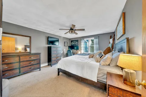 a bed room with a bed and a window