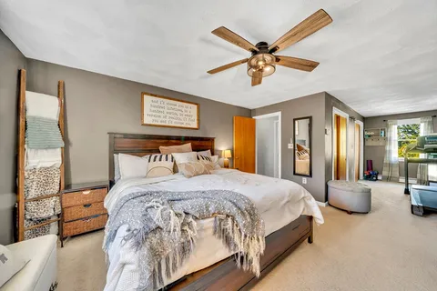 a bedroom with a bed and window