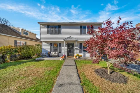 front view of a house with a yard
