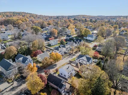 an aerial view of residential houses with outdoor space