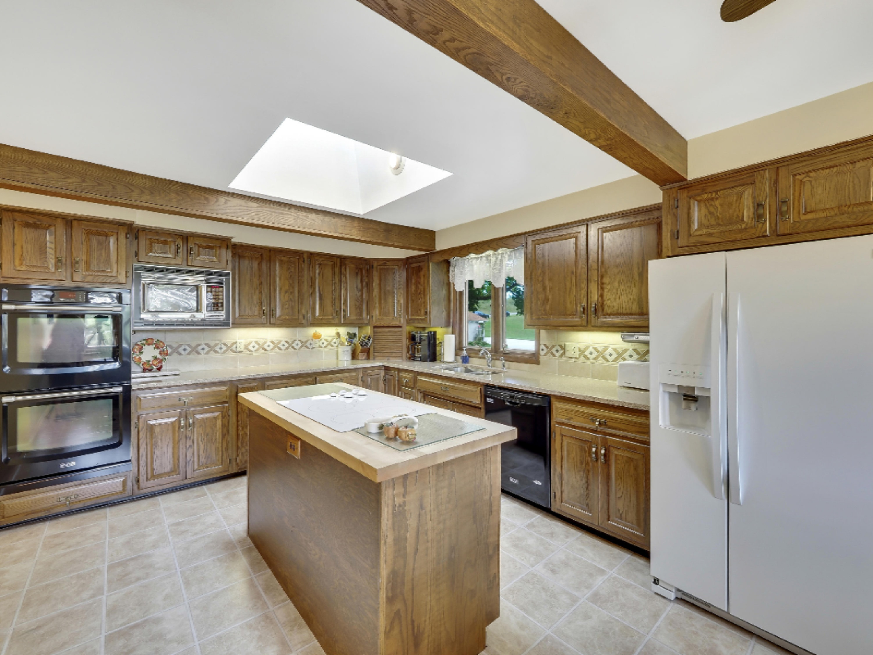 7123 Adamson Lake Road Kaleva, MI 49645 - Photo 6 of 59 Kitchen with cook-top Island