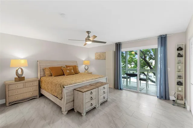 a spacious bedroom with a bed and a table