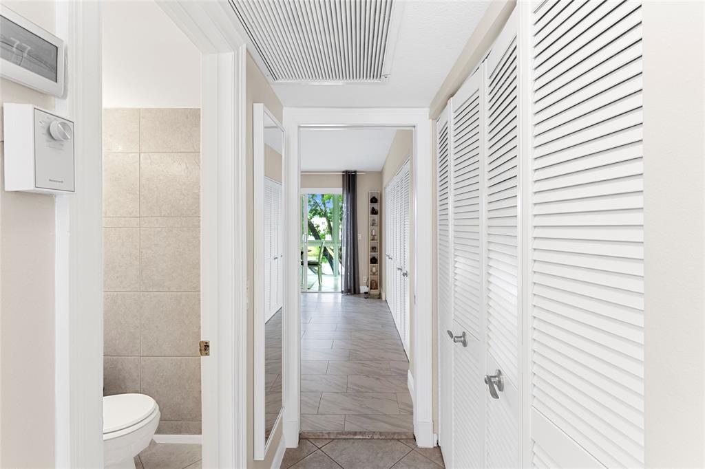 3028 Cambridge B, Unit 3028 Deerfield Beach, FL 33442 - Photo 19 of 49 a view of a bathroom from a hallway