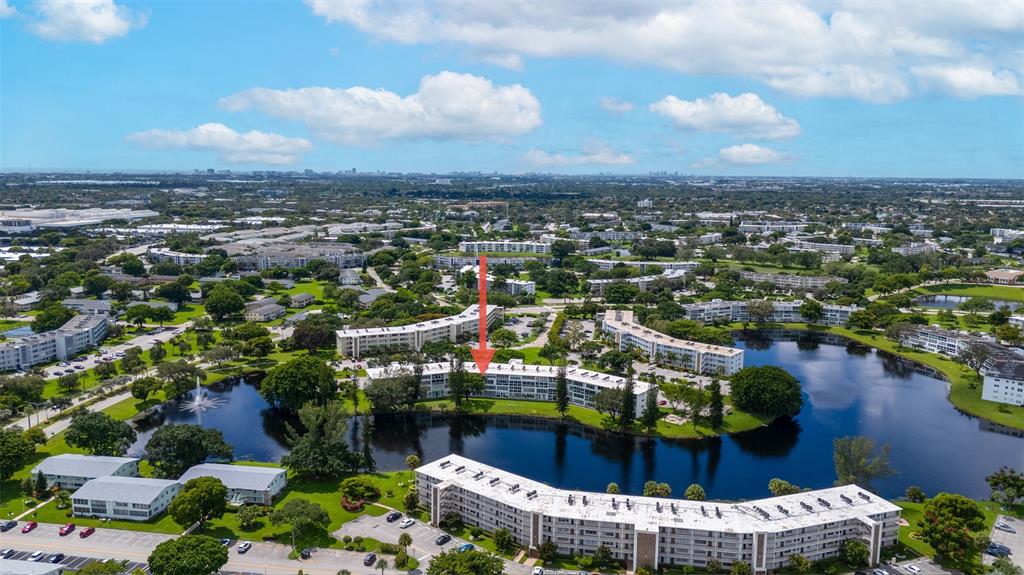 3028 Cambridge B, Unit 3028 Deerfield Beach, FL 33442 - Photo 25 of 49 an aerial view of a house with a lake view