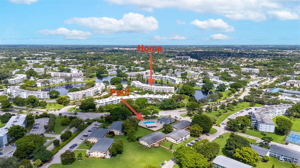 3028 Cambridge B, Unit 3028 Deerfield Beach, FL 33442 - Photo 30 of 49 an aerial view of residential houses with outdoor space