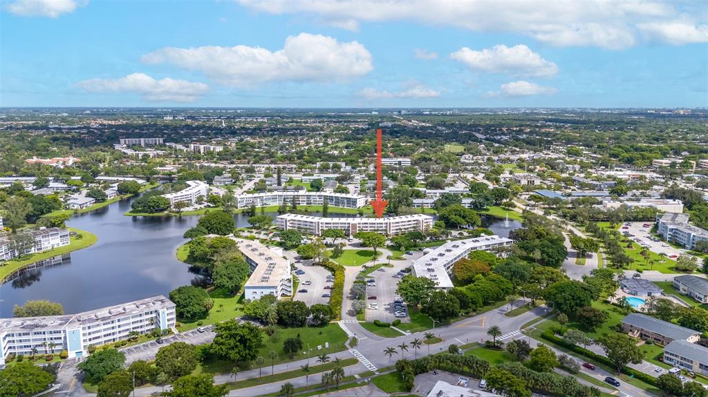 3028 Cambridge B, Unit 3028 Deerfield Beach, FL 33442 - Photo 31 of 49 an aerial view of a city with lots of residential buildings
