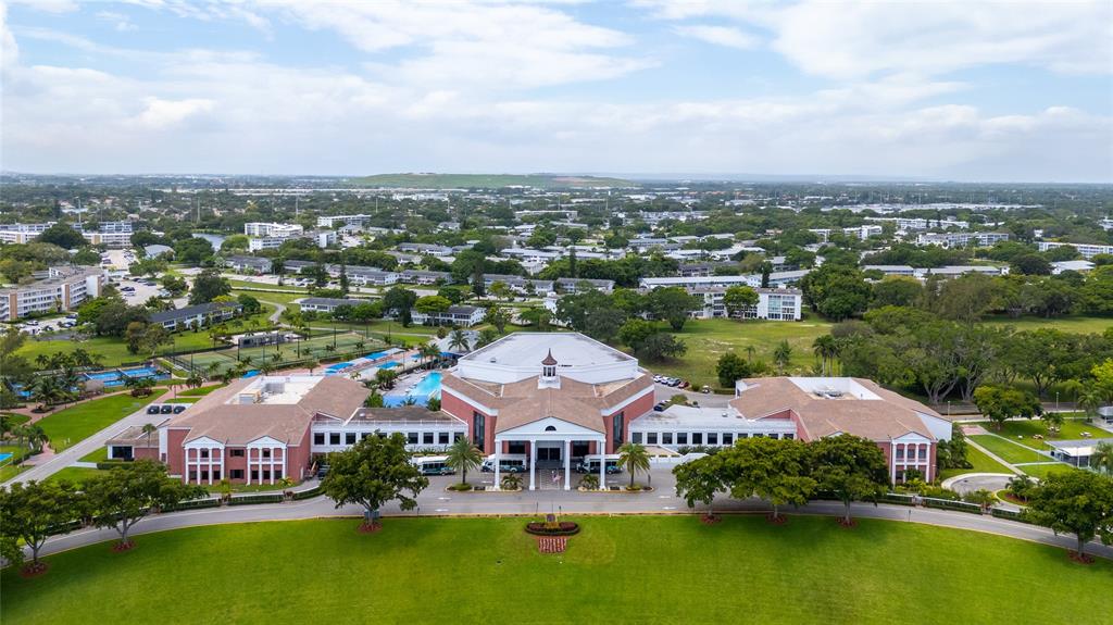3028 Cambridge B, Unit 3028 Deerfield Beach, FL 33442 - Photo 35 of 49 an aerial view of residential houses with outdoor space and lake view