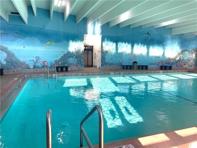 3028 Cambridge B, Unit 3028 Deerfield Beach, FL 33442 - Photo 41 of 49 a room with lots of trees and plants