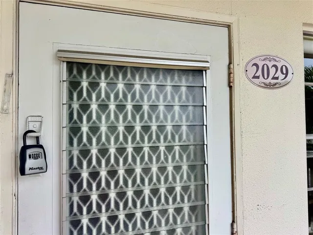 a view of a park with large trees