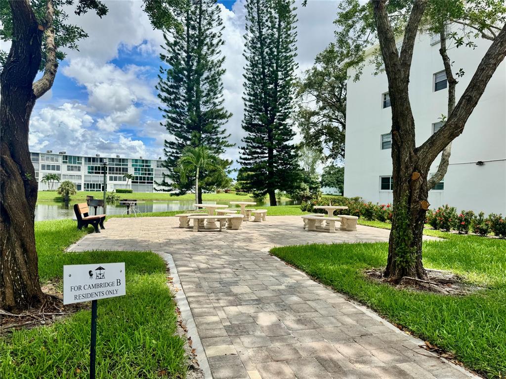 3028 Cambridge B, Unit 3028 Deerfield Beach, FL 33442 - Photo 48 of 49 a view of a park with large trees