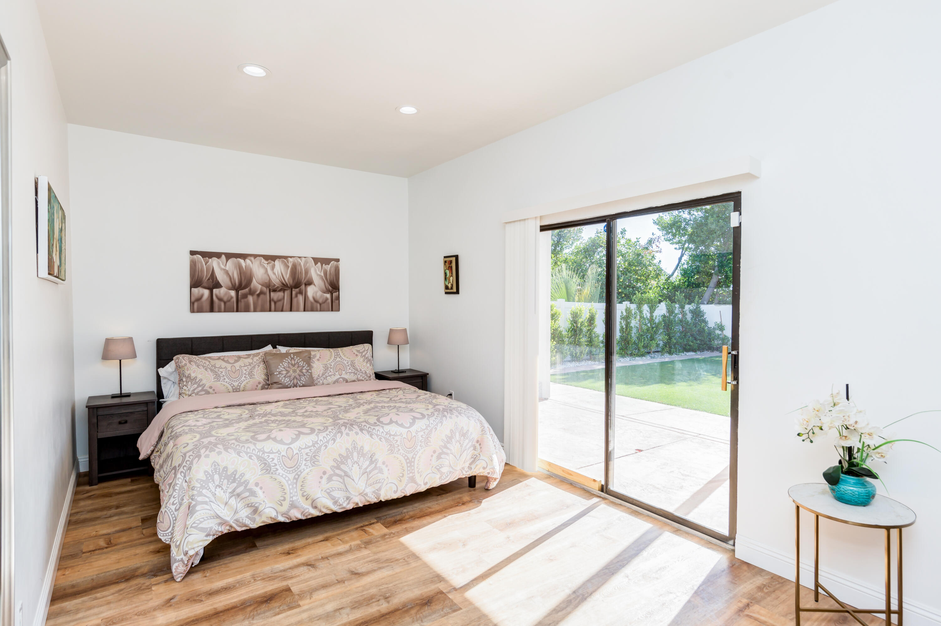 70181 Chappel Road Rancho Mirage, CA 92270 - Photo 14 of 43 a bedroom with a large bed and a potted plant