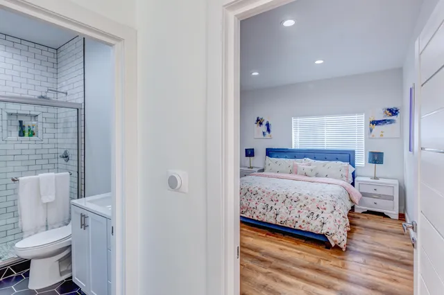 a bedroom with a bed and a couch