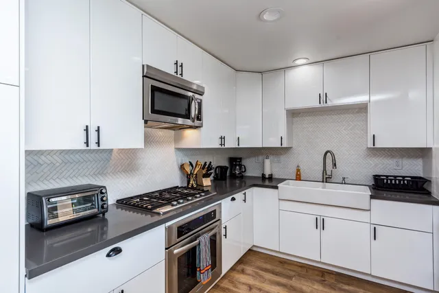 a very nice looking living room with a large window