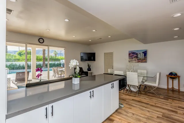a kitchen with a sink stainless steel appliances and cabinets