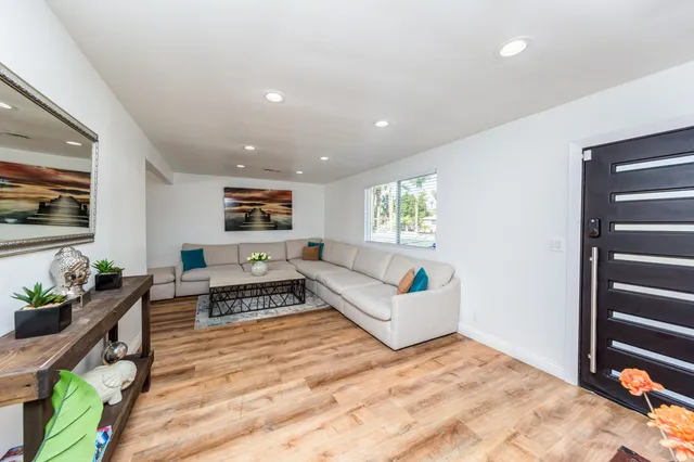 a bedroom with furniture and a window