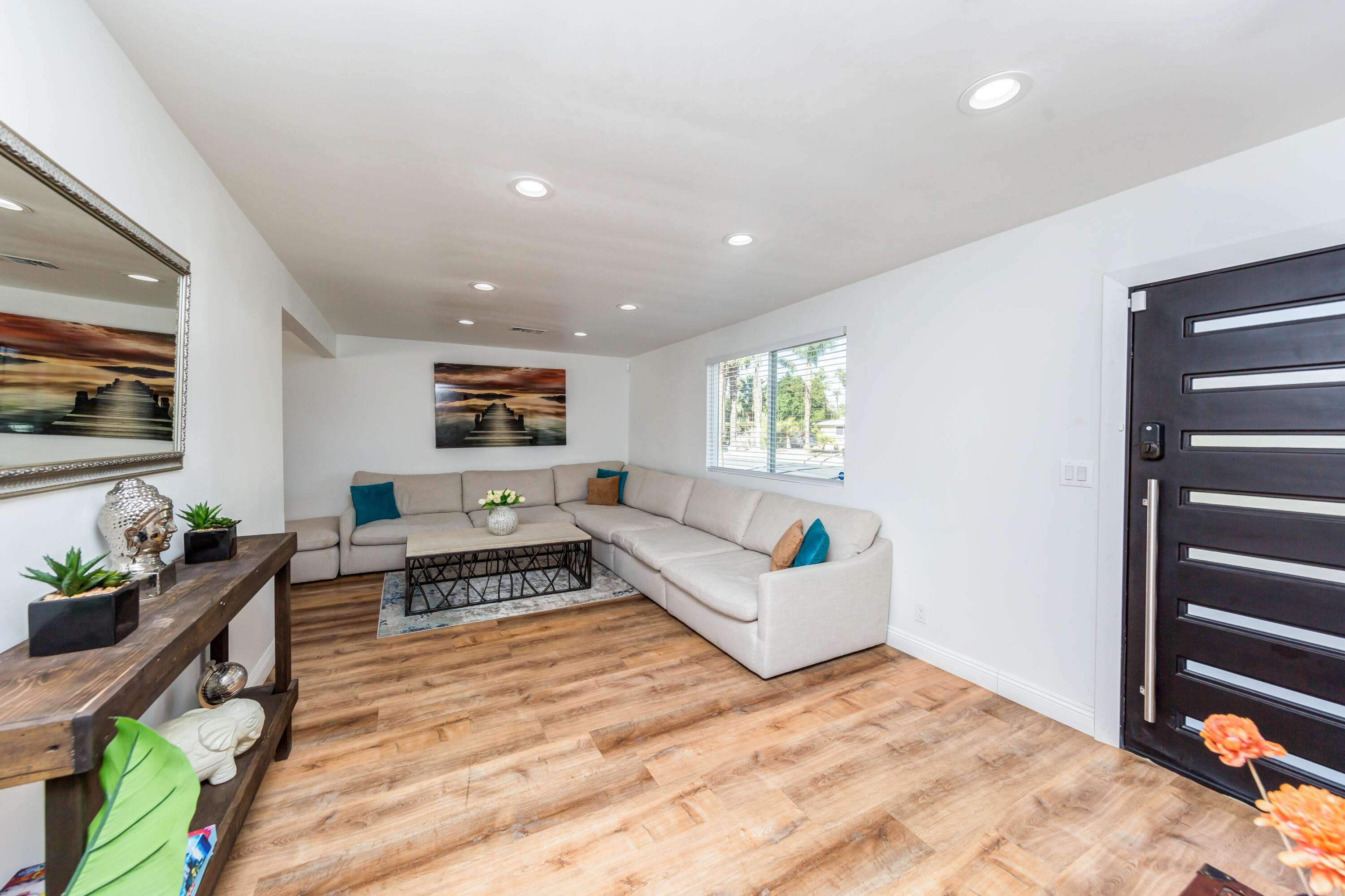 70181 Chappel Road Rancho Mirage, CA 92270 - Photo 36 of 43 a living room with furniture and a flat screen tv