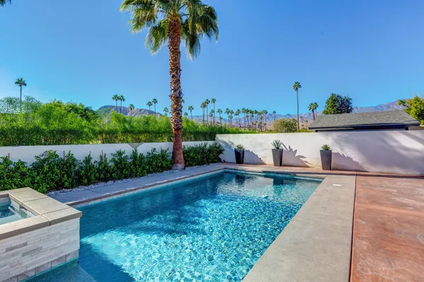 swimming pool view with seating space