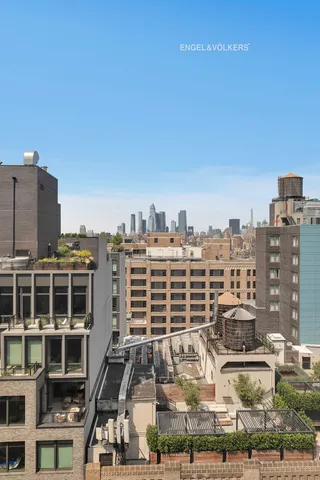 a view of a dining room with furniture and a book shelf