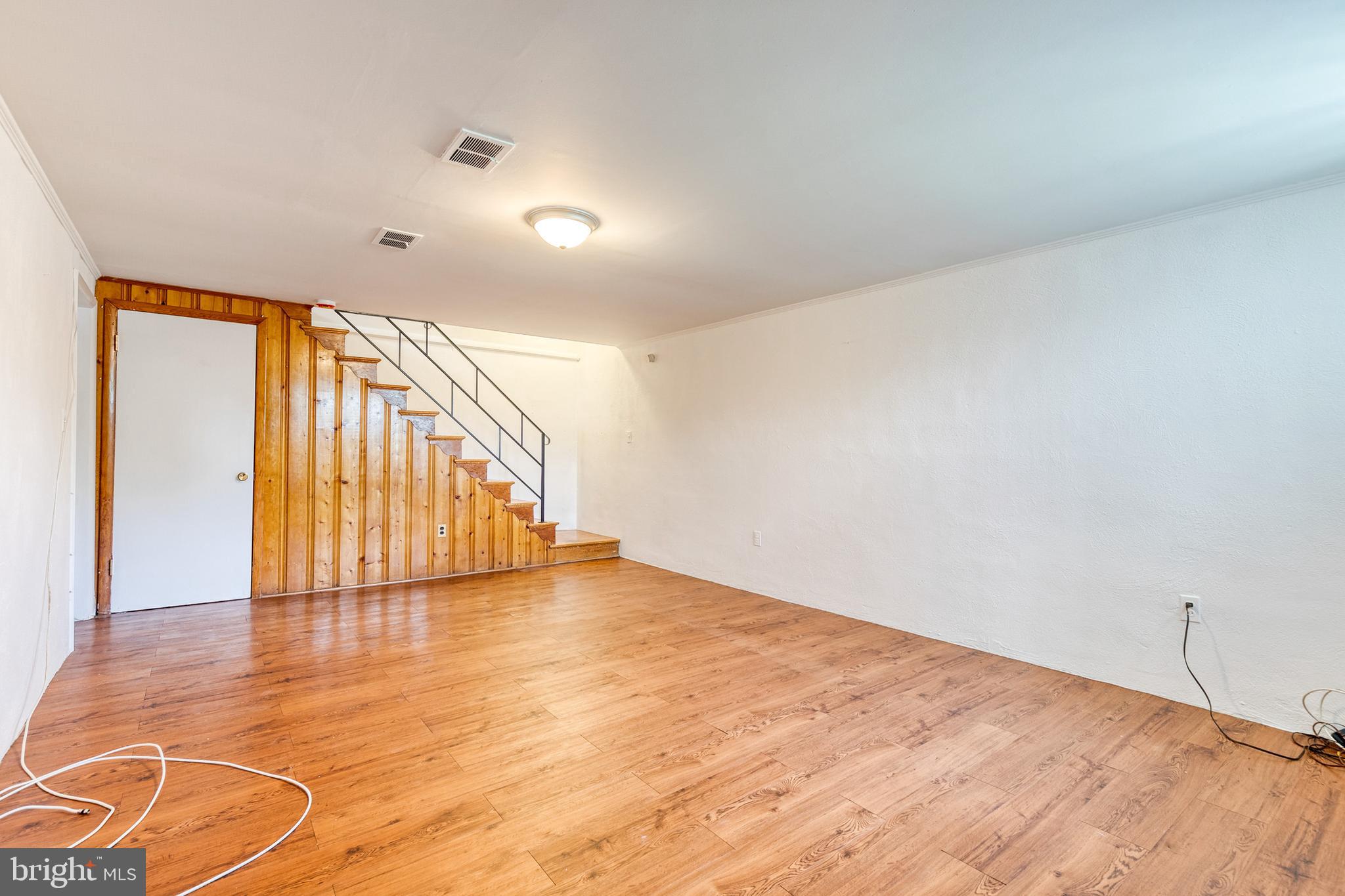 6653 Chippewa Drive Baltimore, MD 21209 - Photo 20 of 24 a view of an empty room with wooden floor