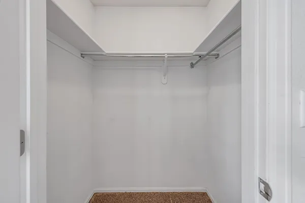 a bathroom with a tub sink shower and mirror