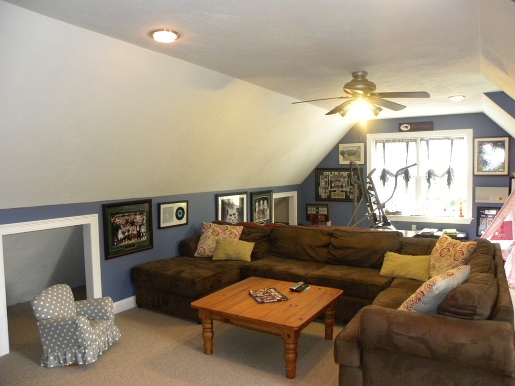 57 McIntyre Road Charlton, MA 01507 - Photo 11 of 30 a living room with furniture and a large window