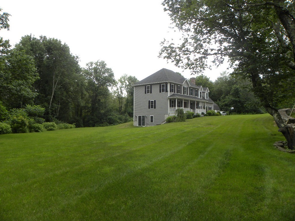 57 McIntyre Road Charlton, MA 01507 - Photo 13 of 30 a view of a house with a big yard