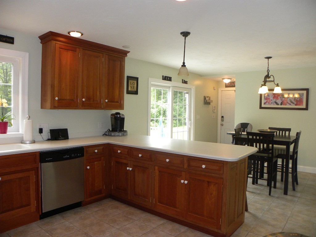 57 McIntyre Road Charlton, MA 01507 - Photo 14 of 30 a kitchen with a sink and stove