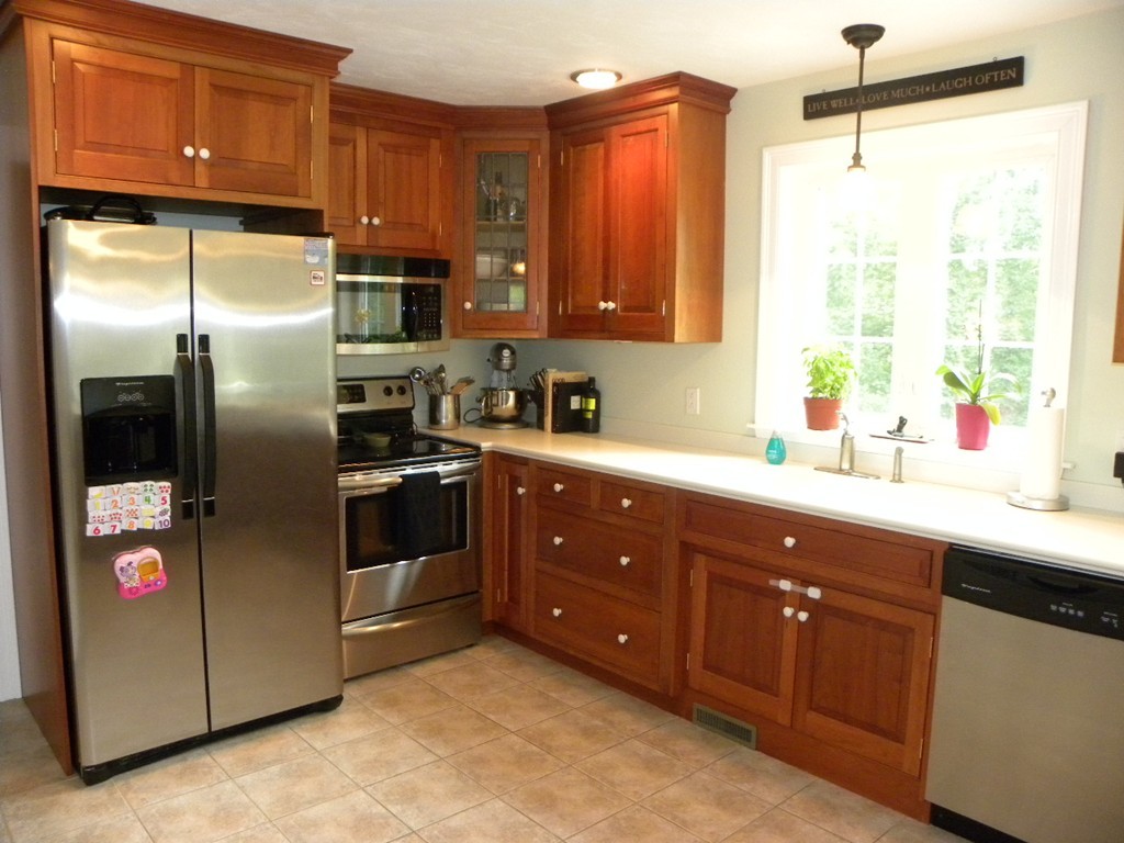 57 McIntyre Road Charlton, MA 01507 - Photo 21 of 30 a kitchen with stainless steel appliances granite countertop a refrigerator a sink a stove and a microwave