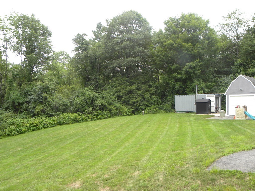 57 McIntyre Road Charlton, MA 01507 - Photo 29 of 30 a view of a big yard with large trees