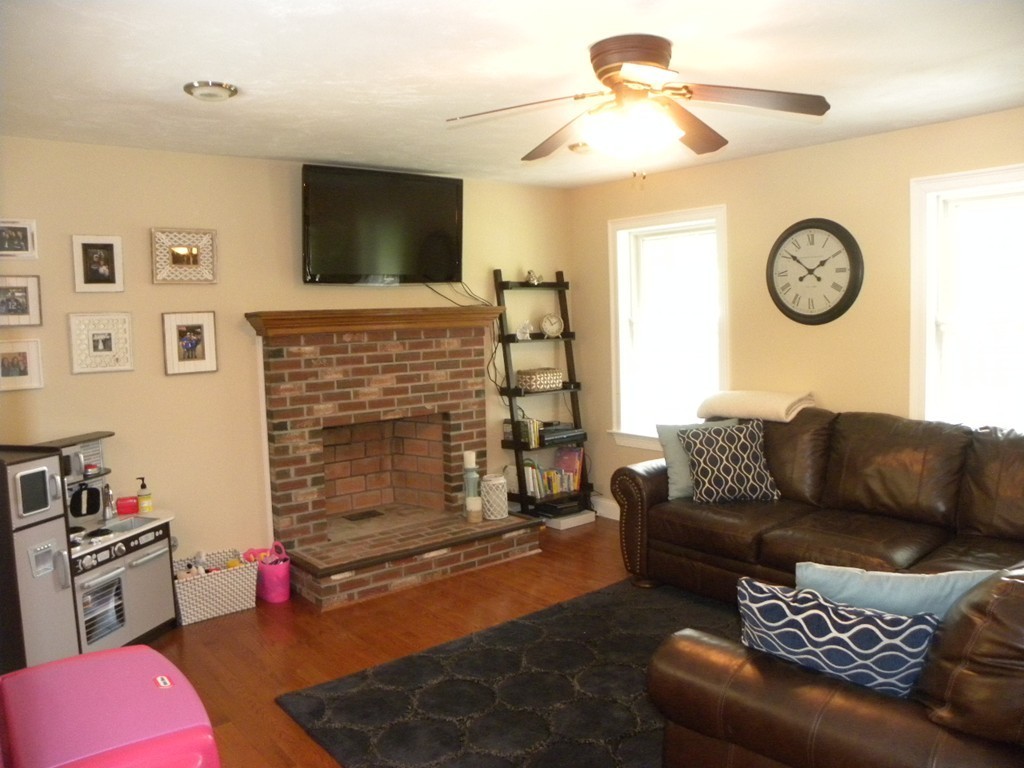 57 McIntyre Road Charlton, MA 01507 - Photo 4 of 30 a living room with furniture and a fireplace