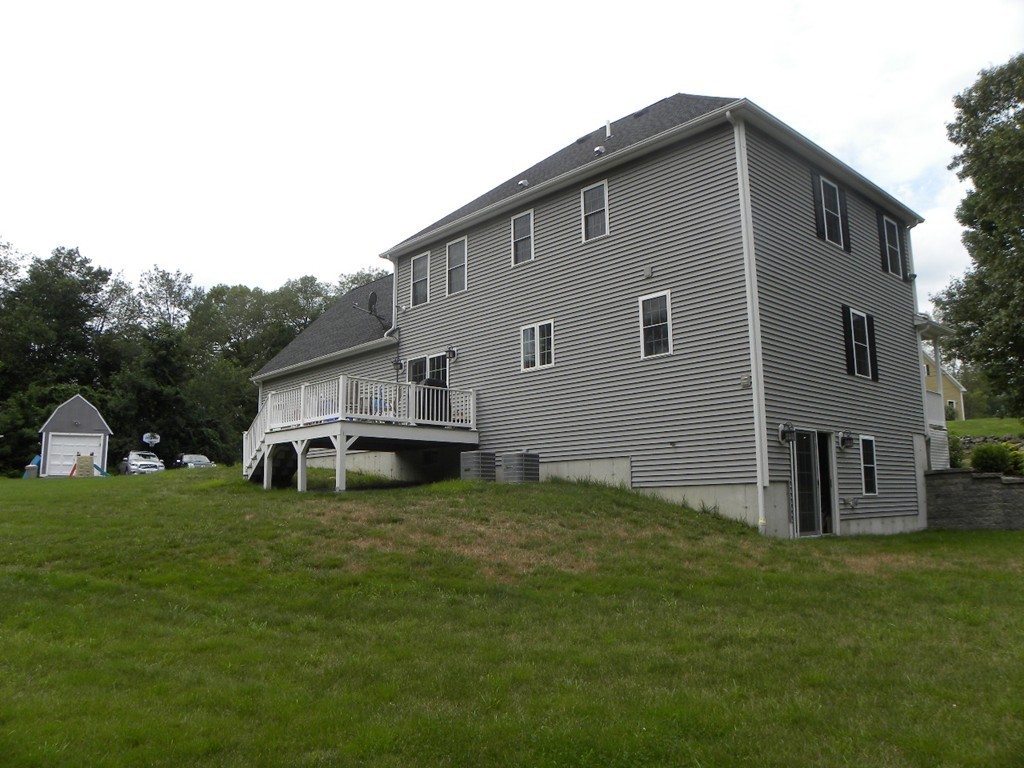 57 McIntyre Road Charlton, MA 01507 - Photo 7 of 30 a view of a house with a yard